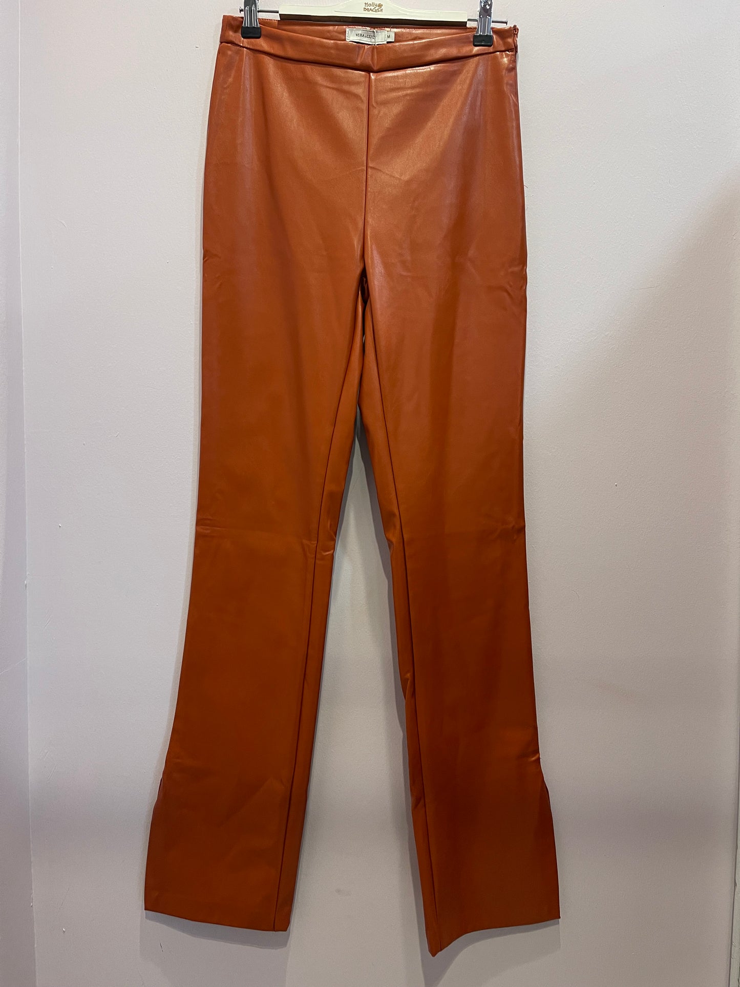 Orange faux leather trousers