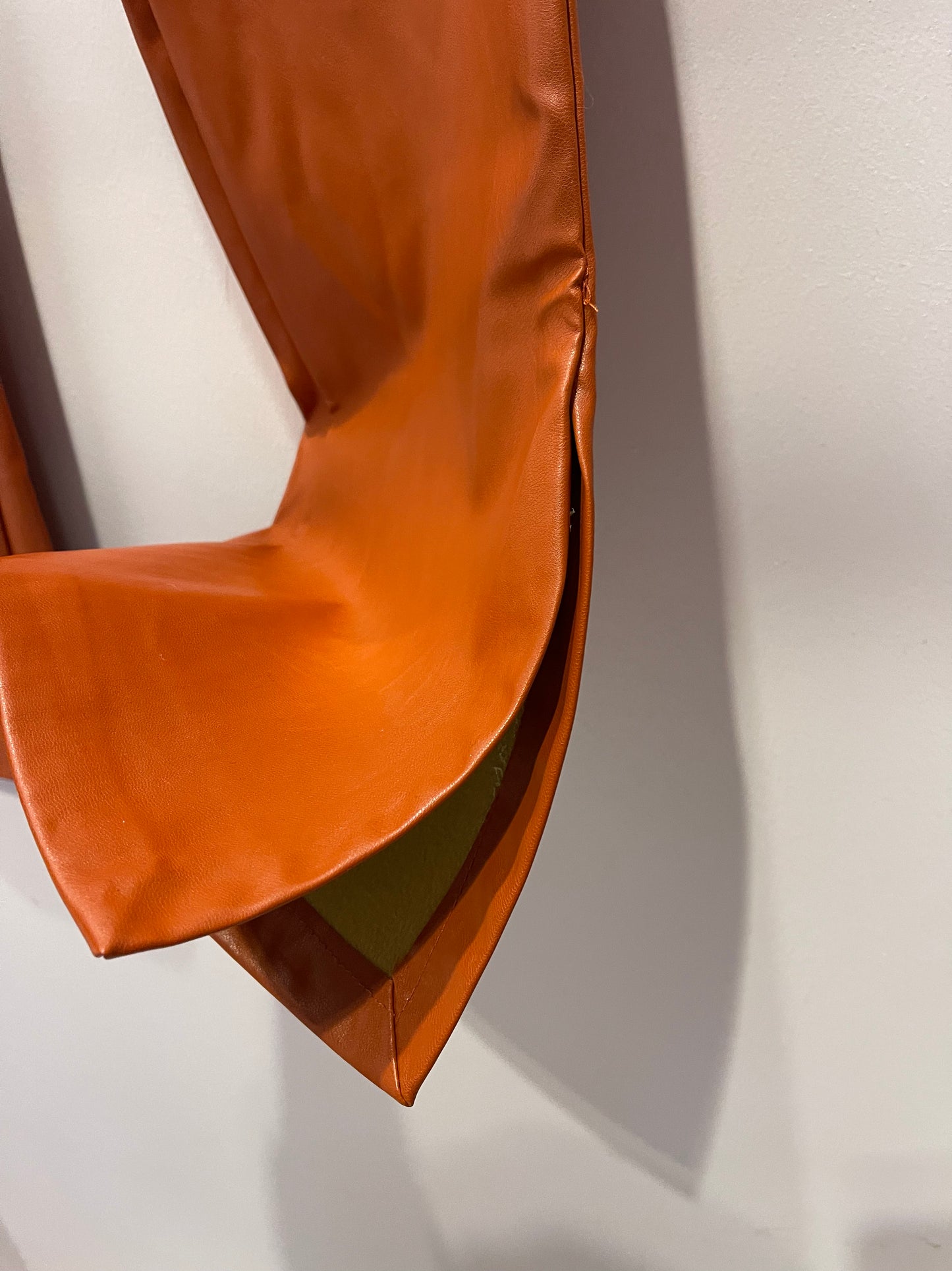 Orange faux leather trousers