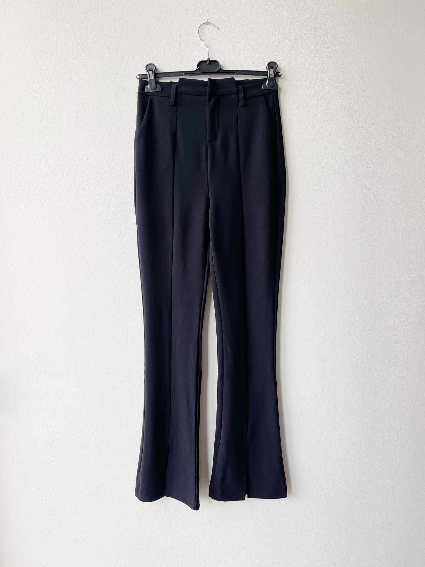 Black flare trousers with front slit