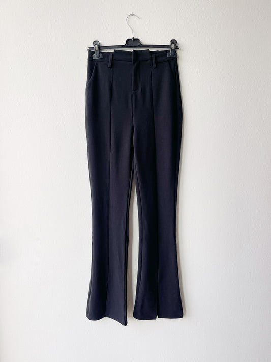 Black flare trousers with front slit