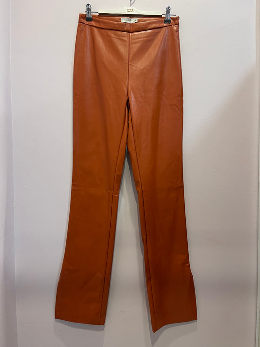 Orange faux leather trousers